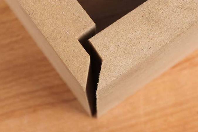 Lapped mitre router bits designed to create strong self-aligning mitre joints in plywood and MDF